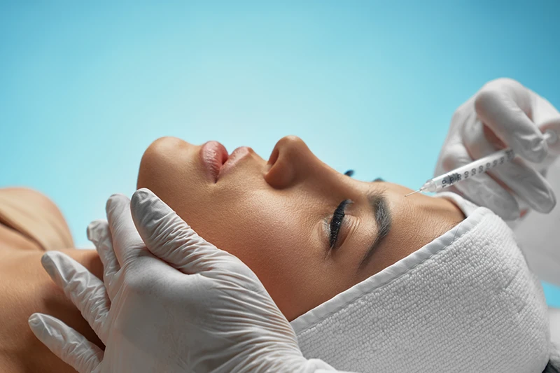 Closeup woman receiving botox injection